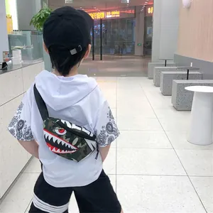 Kids camo chest bag with red shark mouth design and adjustable canvas strap