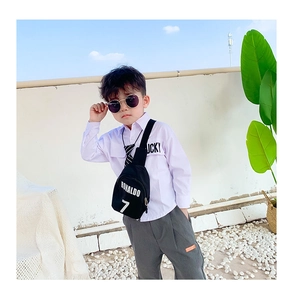 Close-up of kids black canvas chest bag with white Ronaldo 7 print for outdoor sports