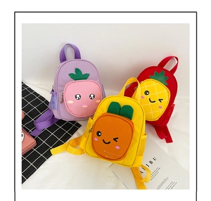Detail of cute kids backpacks with fruit faces, adjustable straps and side mesh pockets