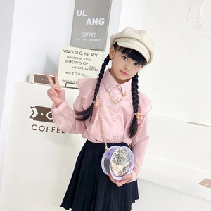 Fashionable girls' purple sequin crossbody bag styled with pink ruffle shirt and skirt