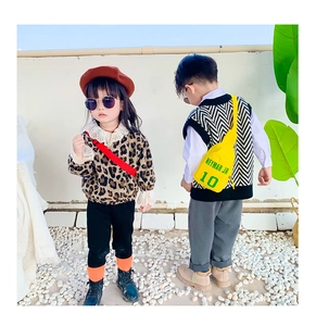 Close-up of kids bright yellow nylon crossbody bag with Neymar JR 10 graphic print