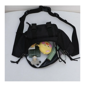 Internal storage detail of kids nylon waist bag showing phone and accessories capacity