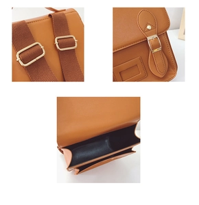 Close-up of caramel PU leather backpack with gold buckles and adjustable nylon straps
