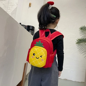 Cute red toddlers backpack with yellow pineapple design and cartoon face for kids
