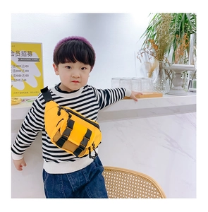 Detail of bright yellow nylon waist bag for kids with black buckle and mesh pocket
