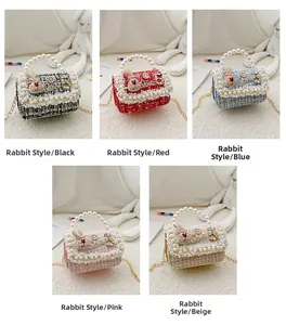 Detail view of tweed mini crossbody bags with pearl handles and 3D bunny accents