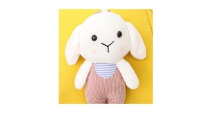 Close-up of cute plush bunny charm with corduroy overalls and metal chain detail