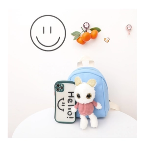 Sky blue canvas mini backpack with cute white plush bunny doll and a size comparison