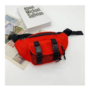 Detail of red nylon kids waist bag featuring black adjustable straps and buckle closure
