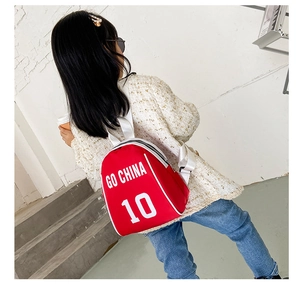 Detail view of red shell-shaped backpack for kids featuring GO CHINA 10 print design