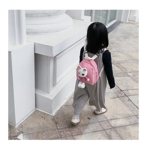 Pink toddler backpack with cute plush bunny doll and adjustable white shoulder straps