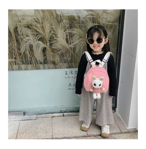 Pink children backpack with cute plush bunny doll and adjustable straps for girls