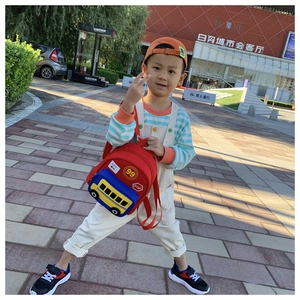 Detailed view of kids school backpack with colorful school bus pattern and adjustable straps