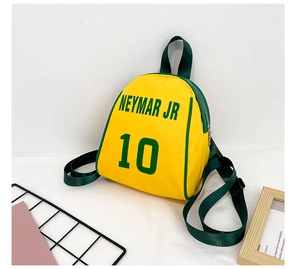 Close-up of yellow kids shell backpack featuring green Neymar JR 10 letter print