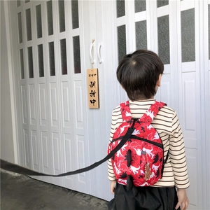 Toddler backpack with red dinosaur print and detachable anti-lost safety leash cord