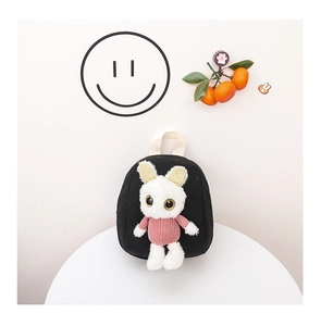 Detail of a black canvas kid backpack featuring a cute 3D bunny plush with sequined ears