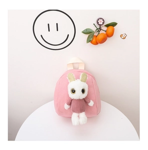 Detail of pink toddler backpack featuring a 3D plush bunny with gold glitter ear accents