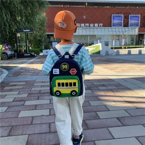 Kids lightweight school backpack with school bus design shown in a back view