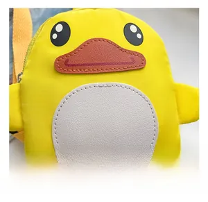 Close-up of cute cartoon duck crossbody bag with red beak and white belly patch detail