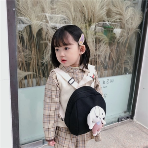 Kids black canvas backpack with a cute white bunny plush pendant for boys and girls