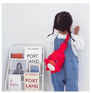 Rear view of a child wearing a red cartoon duck chest bag with adjustable strap details