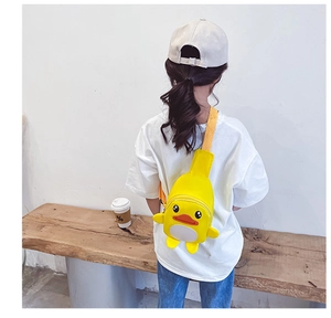 Detailed view of yellow cartoon duck crossbody chest bag with adjustable strap for kids