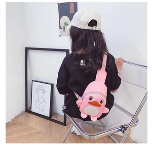 Kids pink duck crossbody chest bag shown on model for size and fit illustration