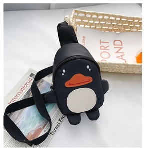 Close-up of cartoon duck chest bag for kids in black fabric with orange beak detail