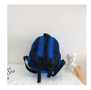 Detailed view of breathable mesh back panel and adjustable straps on navy kids backpack