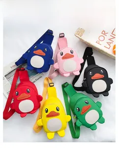 Detail showing various colors of children's cartoon duck crossbody bags on white background
