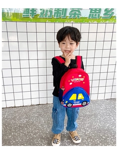 Detailed close-up of the cartoon police car pattern on the red and blue children backpack