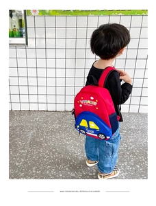 Detail showing the cartoon police car design and durable fabric on this kids backpack