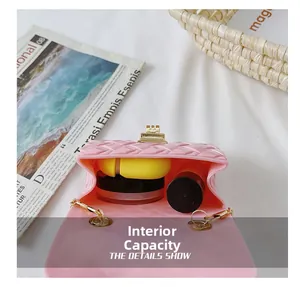 Detail view of pink jelly bag interior with pearls, showing compact storage capacity