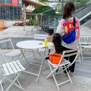 Nylon chest bag detail showing blue and orange crossbody fanny packs for kids and parents