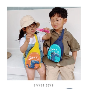 Detail view of cute dinosaur eggshell crossbody bags in yellow and navy on child models