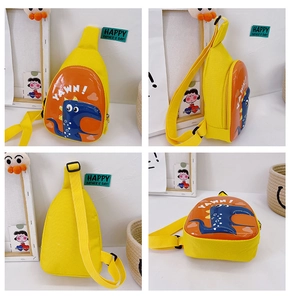 Detail of yellow dinosaur egg shell kids bag with adjustable strap and yawn graphics