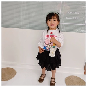 Kids fashion set featuring white cartoon tee, black lace tiered skirt and pearl bag