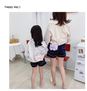 Pink and purple bow shoulder bags shown on models for size comparison and style