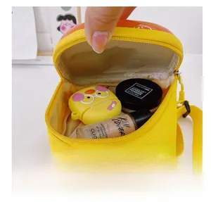 Internal storage detail of the yellow dinosaur egg crossbody bag for kids