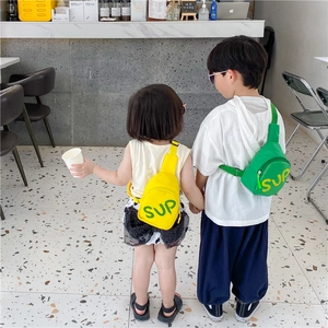 Detail view of colorful kids sling bags with SUP lettering and adjustable straps