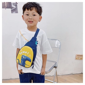 Detail of navy blue canvas dinosaur chest bag with yellow straps and cute illustrations