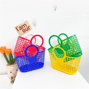 Detail of colorful hollow plastic mesh tote baskets for kids in red blue yellow and green