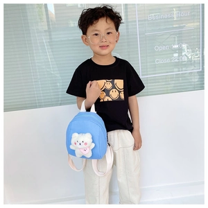 Sky blue kids backpack featuring a cute 3D plush bear charm and white adjustable straps