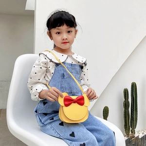 Cute mouse-shaped yellow leather crossbody bag for girls with a red 3D bow accent