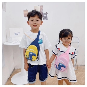 Kids cute dinosaur eggshell crossbody bags with adjustable straps shown on child models