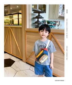 Detailed view of kids' colorful waist bag with PLAY logo and adjustable white strap