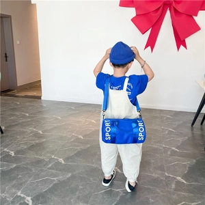 Blue cylindrical kids sports crossbody bag with large SPORT print and adjustable strap