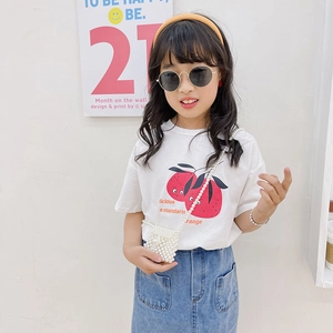 Kids stylish white orange tee and denim skirt outfit with a mini pearl chain bag
