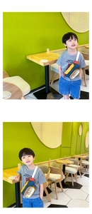 Close-up of colorful patchwork kids chest bag with PLAY text and white adjustable strap