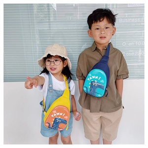 Detail of dinosaur egg-shell chest bags for kids showing yellow and blue colors